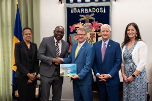 TNC Caribbean's Executive Director presents a document to the government of Barbados.