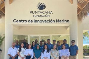 The Center for Marine Innovation Team stands at the entry of the facility.