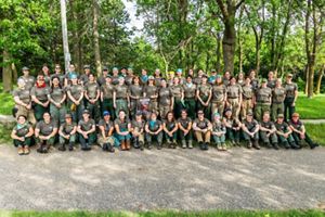 2026 Academy participants smile while posing for a group photo.