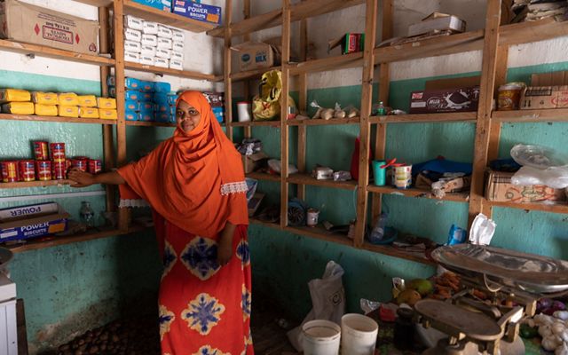 Fatuma Athman stands in her shop in Pate, Kenya.