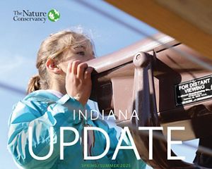 Cover artwork for TNC Indiana spring 2025 newsletter featuring little girl looking through a spotting scope.