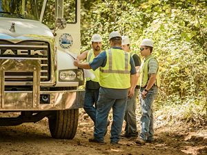 workers in the Arkansas Unpaved Roads Program