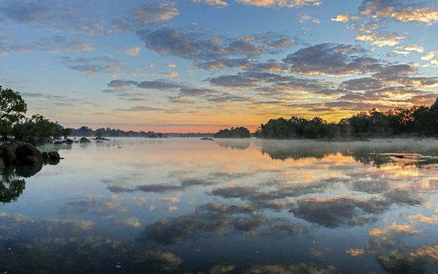 Sunrise on the Kafue River in Kafue National Park, one of Zambia's most important wildlife, tourism, and wilderness areas.