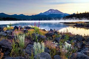Image of mountains with lake in front of it. 