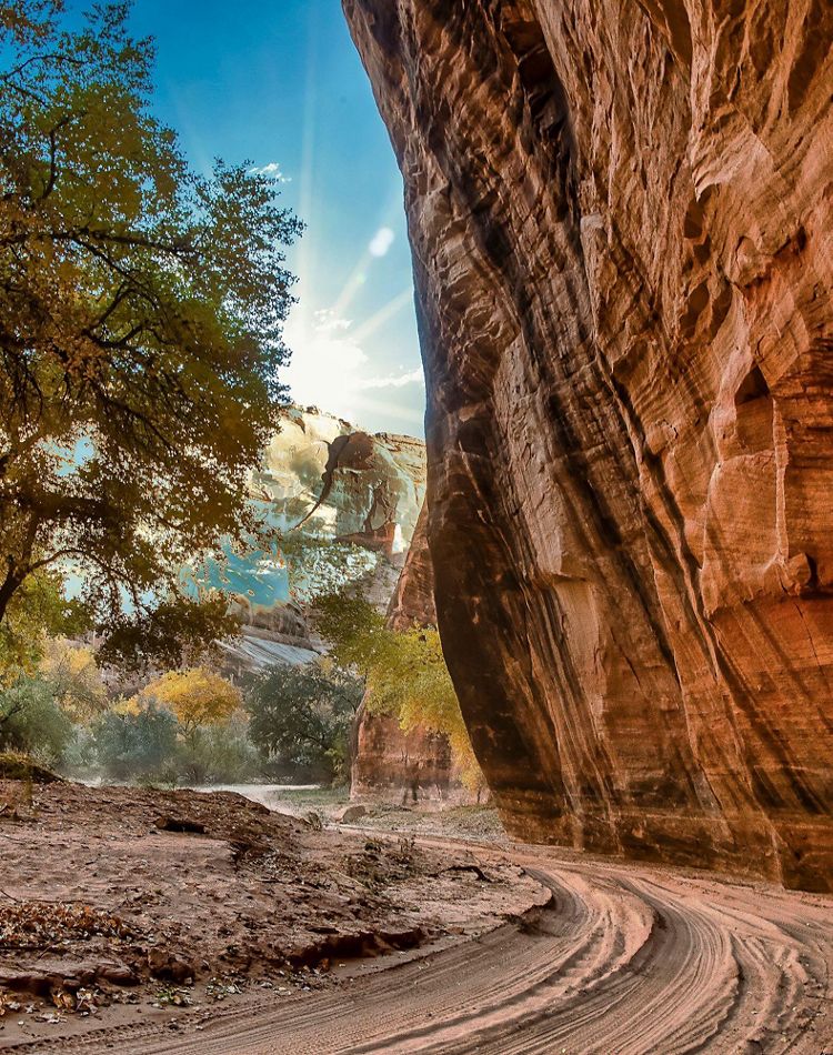The rays of the sun peek through at Canyon de Chelly.