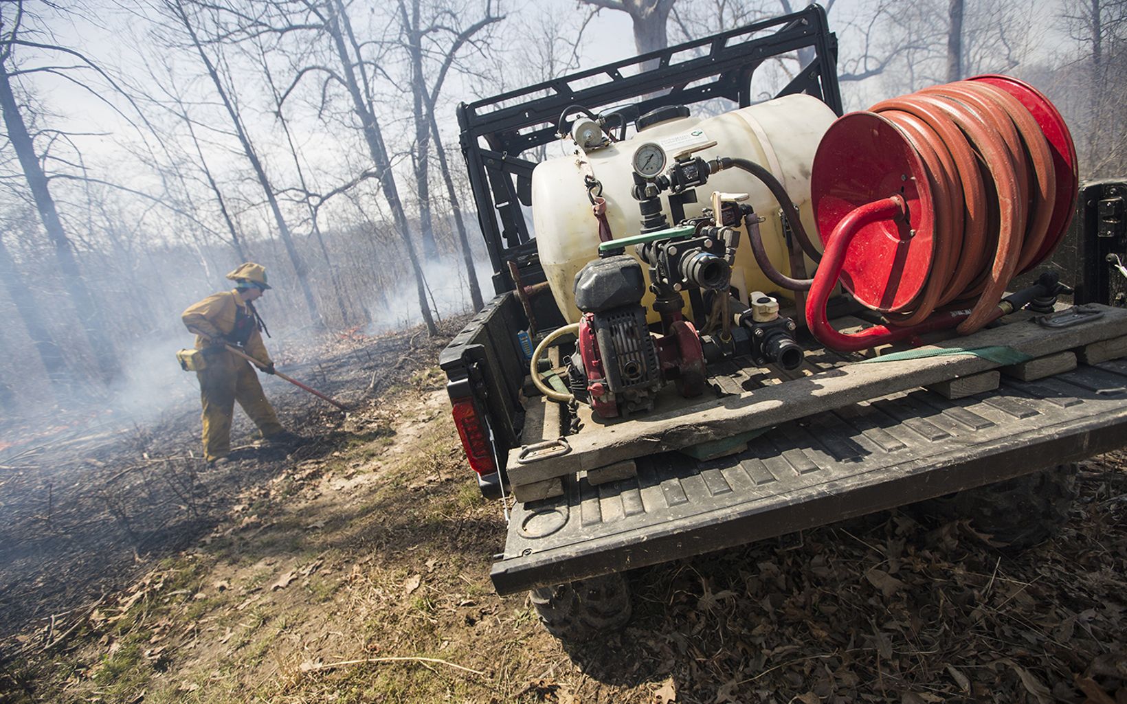 
                
                  Prescribed Fire After a prescribed fire, raking takes place to address any hot areas.
                  © Mike Wilkinson
                
              