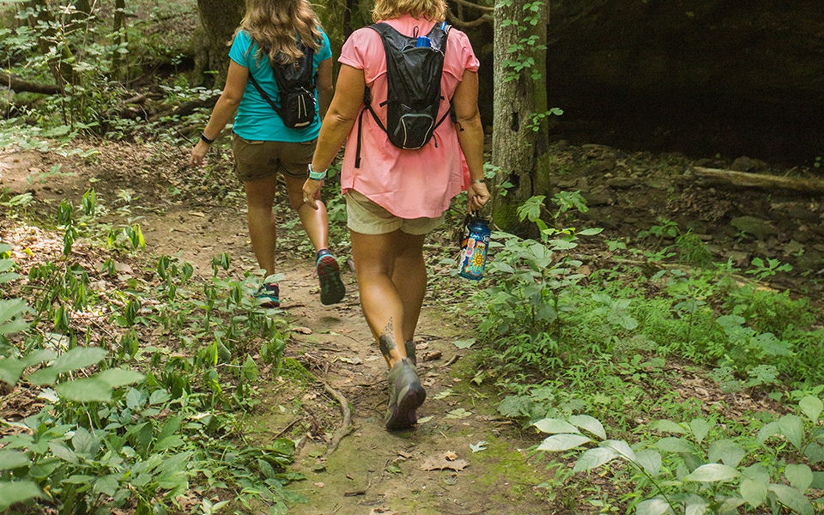 Hiking Two hikers enjoy the trail at Mantle Rock Nature Preserve. © Mike Wilkinson