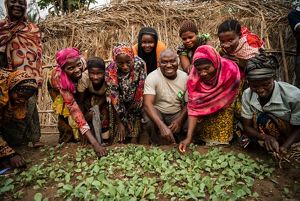The Nature Conservancy's Agriculture officer, Clement Mabula, teaches a group of farmers sustainable agriculture methods near Lake Tanganyika in the village of Mgambo, Tanzania.  Lake Tanganyika holds nearly one-fifth of the world’s freshwater, is the world’s second largest lake by volume, and is home to 250 endemic species of fish. It provides 40% of all protein for lakeshore villages.   