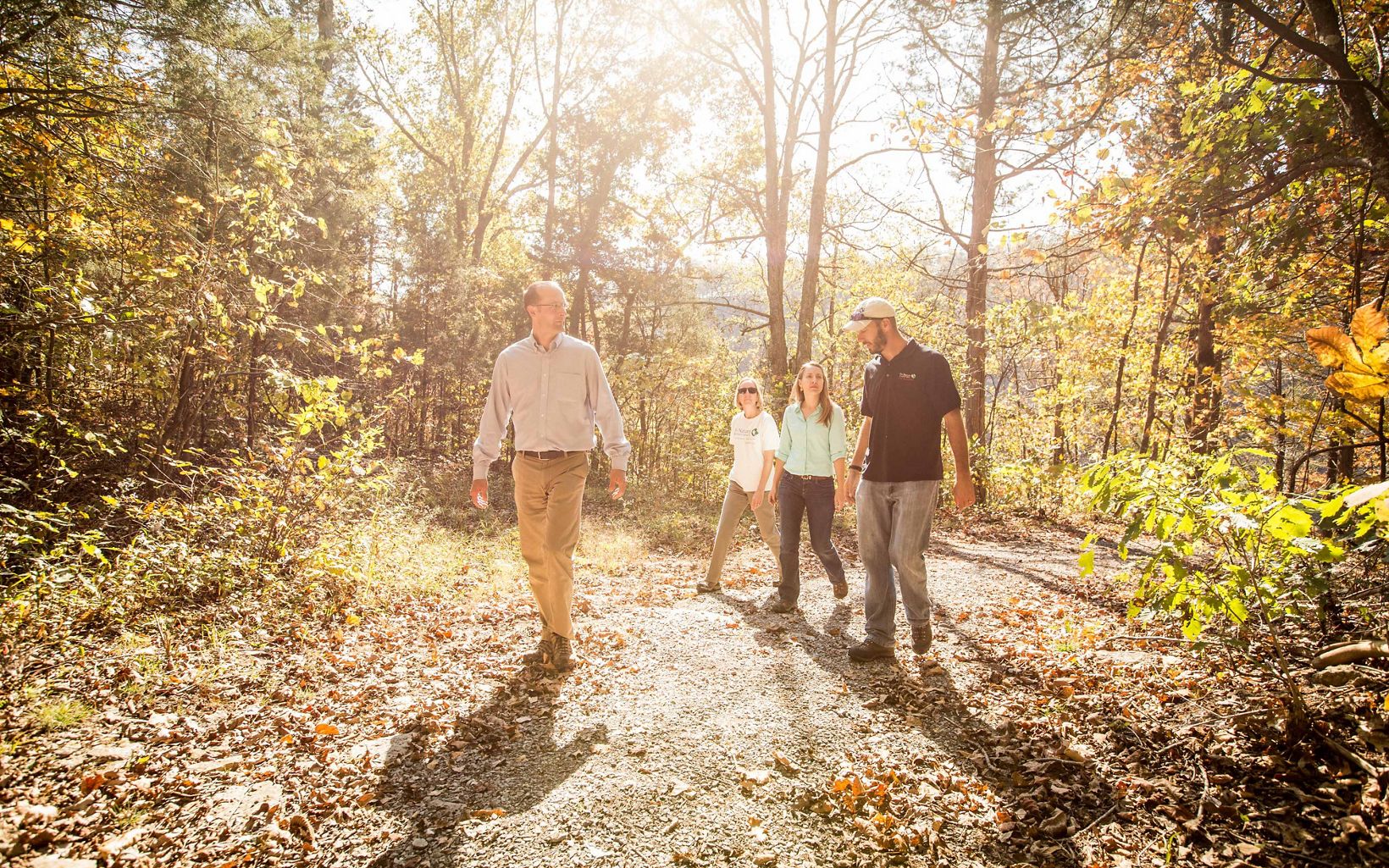 Members of TNC's Kentucky staff take a walk at the Dupree Nature Preserve during autumn. 