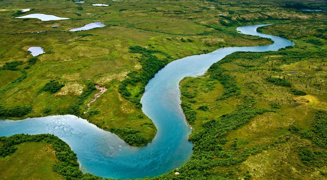 Aerial photo of a river winding through countryside.