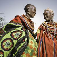 Two Samburu women laughing together.