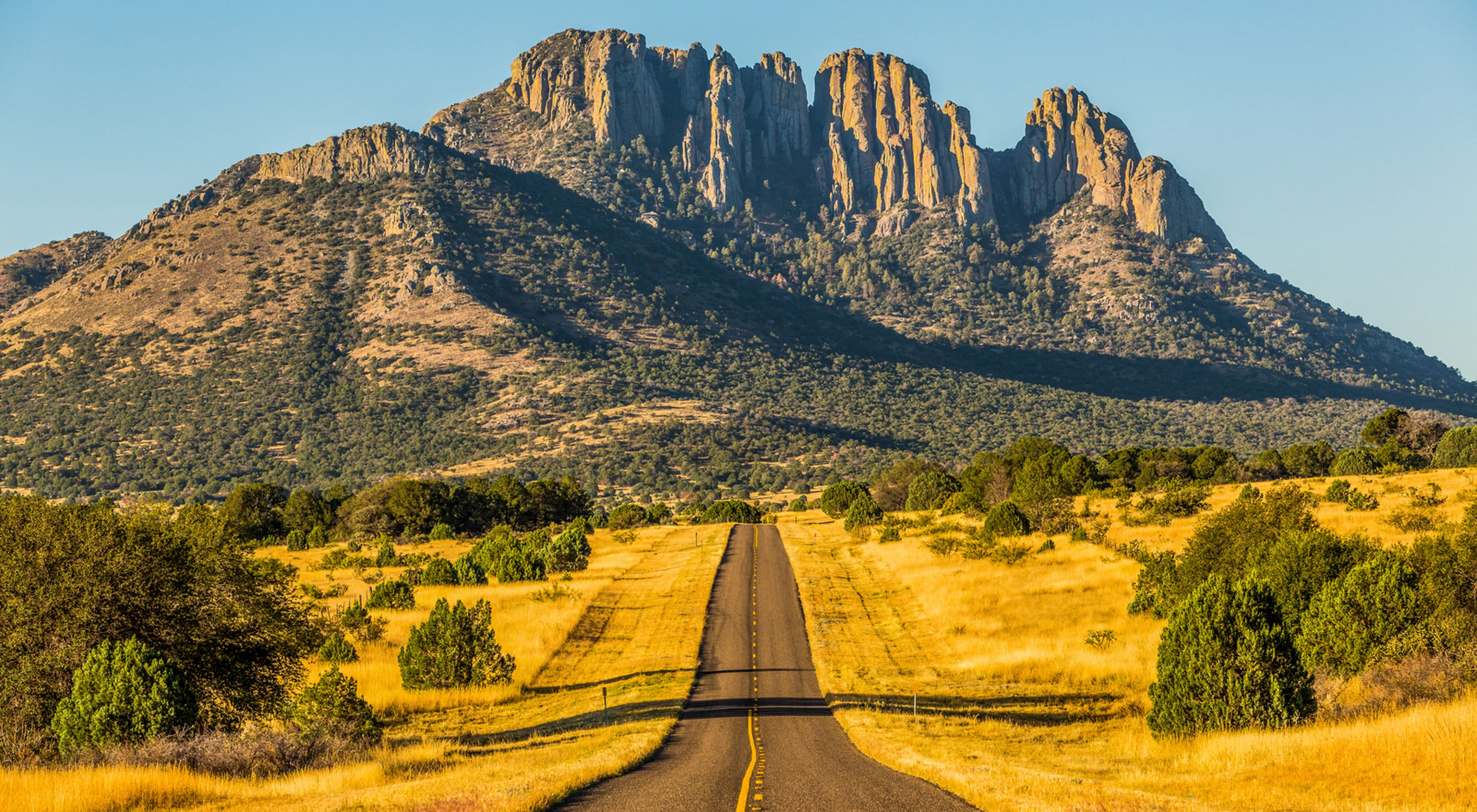 Photo of a highway approaching the Sawtooth Mountains in Texas.