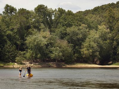 Two kayakers on a river.