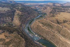 Photo of a canyon with a river running through it.