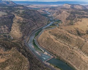 Photo of a canyon with a river running through it.