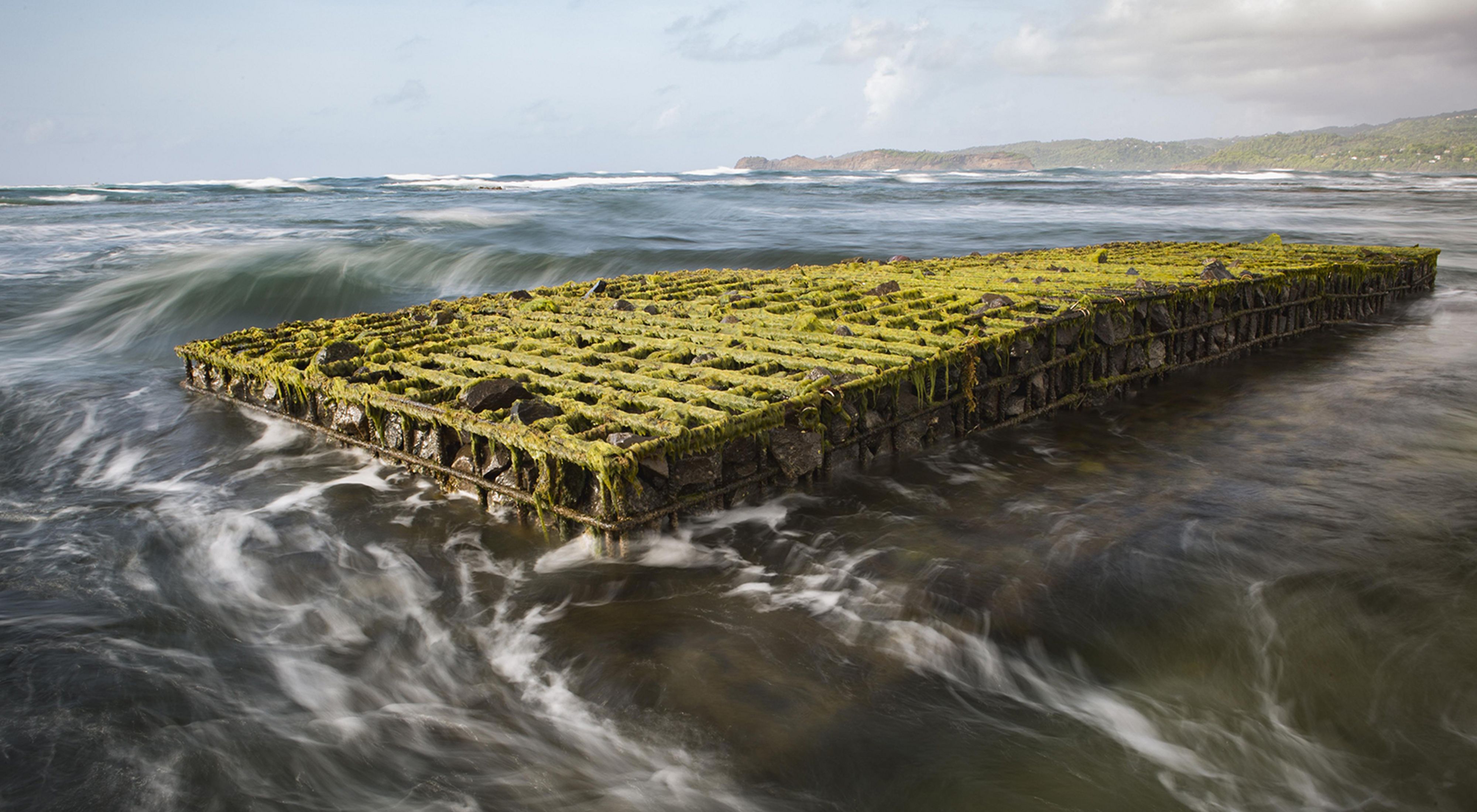 An artificial reef is surrounded by waves in Grenada