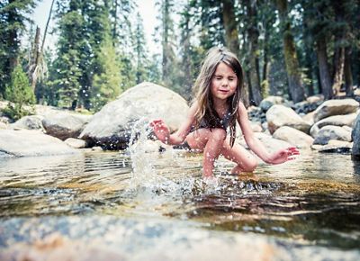 A child playing in the Marble Fork of the Kaweah River.