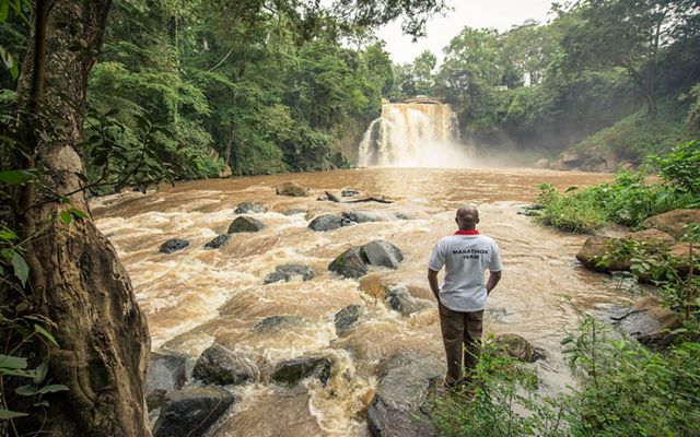 TNC's Fred Kihara looks at the Chania Falls in Thika near Nairobi in the Upper Tana River Watershed, Kenya.