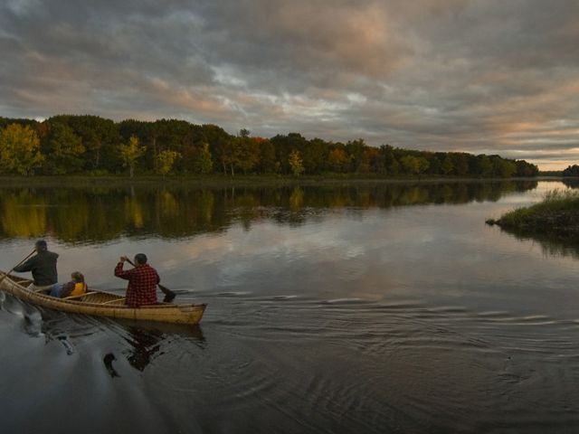 People kayaking on lake.