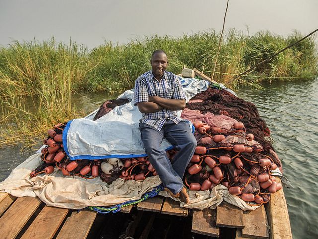 man sitting on a boat