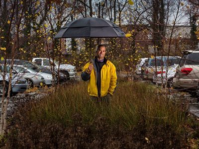Urban Program Director of TNC’s Maryland/DC chapter in the parking lot of the First United Methodist Church of Hyattsville, MD. it is the site of a stormwater runoff project.
