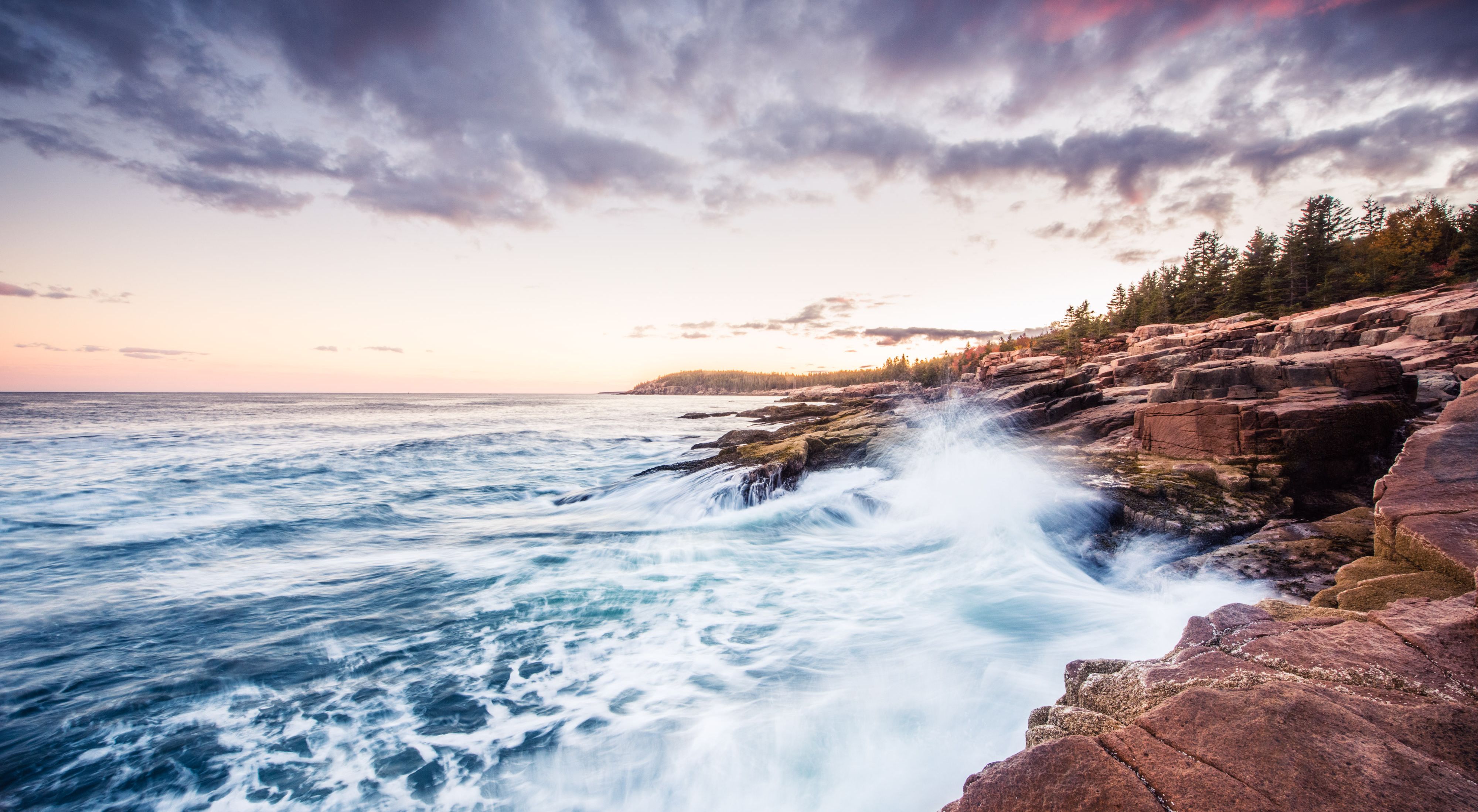 (ALL INTERNAL RIGHTS & LIMITED EXTERNAL RIGHTS) October 2015. Waves crashing against the rocky coast of Acadia National at sunset in Maine. The park service and vistor's celebrate 100 years of parks in August 2016. Photo credit: © Nick Hall