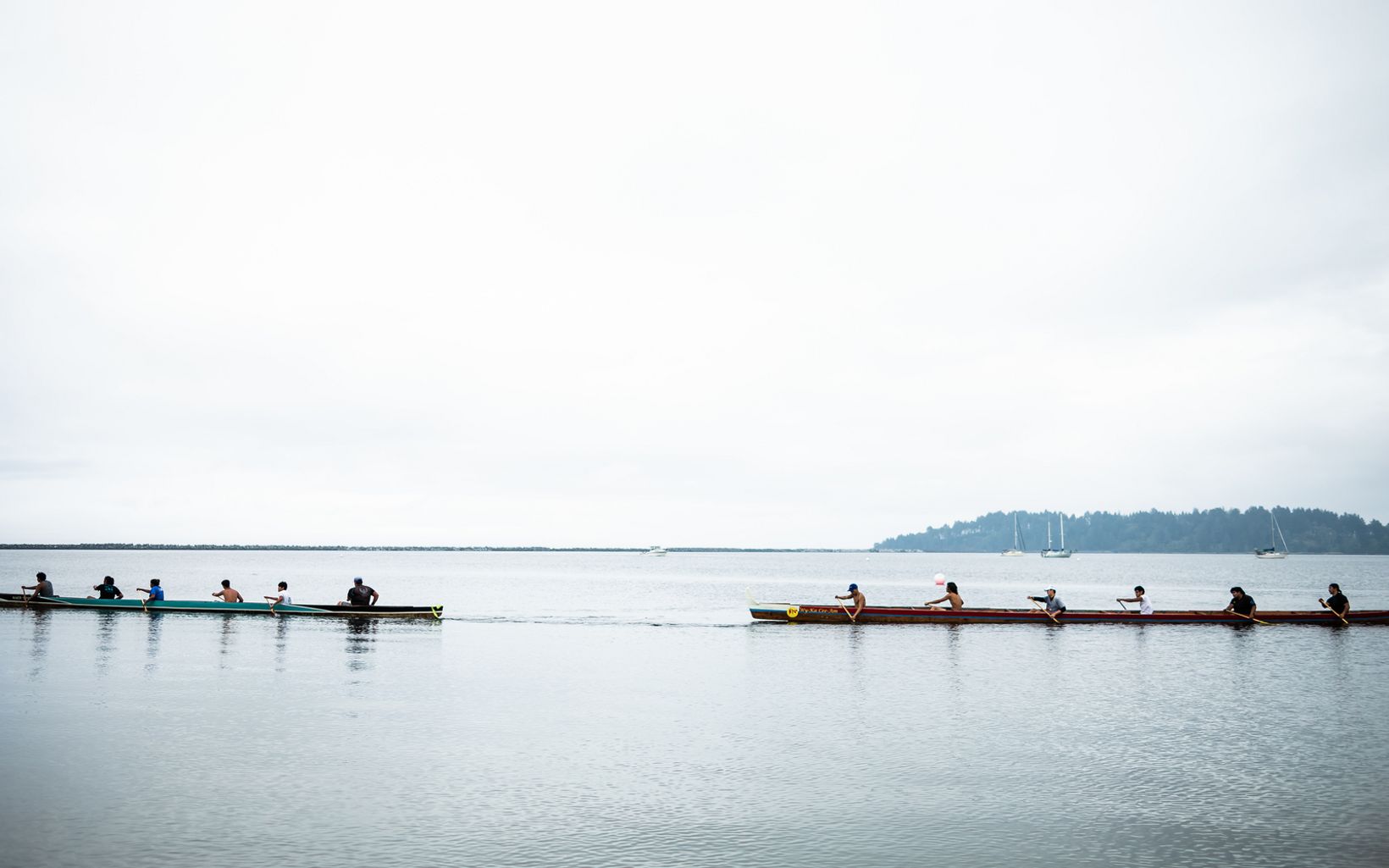 Tribal members travel by canoe in Washington state.