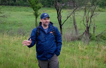 A photo of Matt Allender talking.