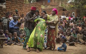 Tuungane Project volunteers perform in a drama group for the community of Mgambo on Lake Tanganyika in western Tanzania. The group teaches through skits on issues ranging from teenage pregnancy to sustainable forestry.