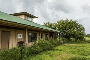 A long, one-story building at the Texas City Prairie Preserve, which serves as headquarters for staff, educational activities, and conservation efforts.