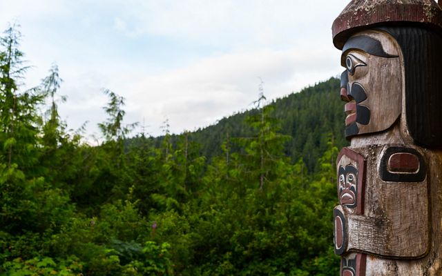 The Watchman Totem Pole guards the Big House and watches over the village of Klemtu from in front of the Kitasoo/Xai'xais Big House in Klemtu, British Columbia
