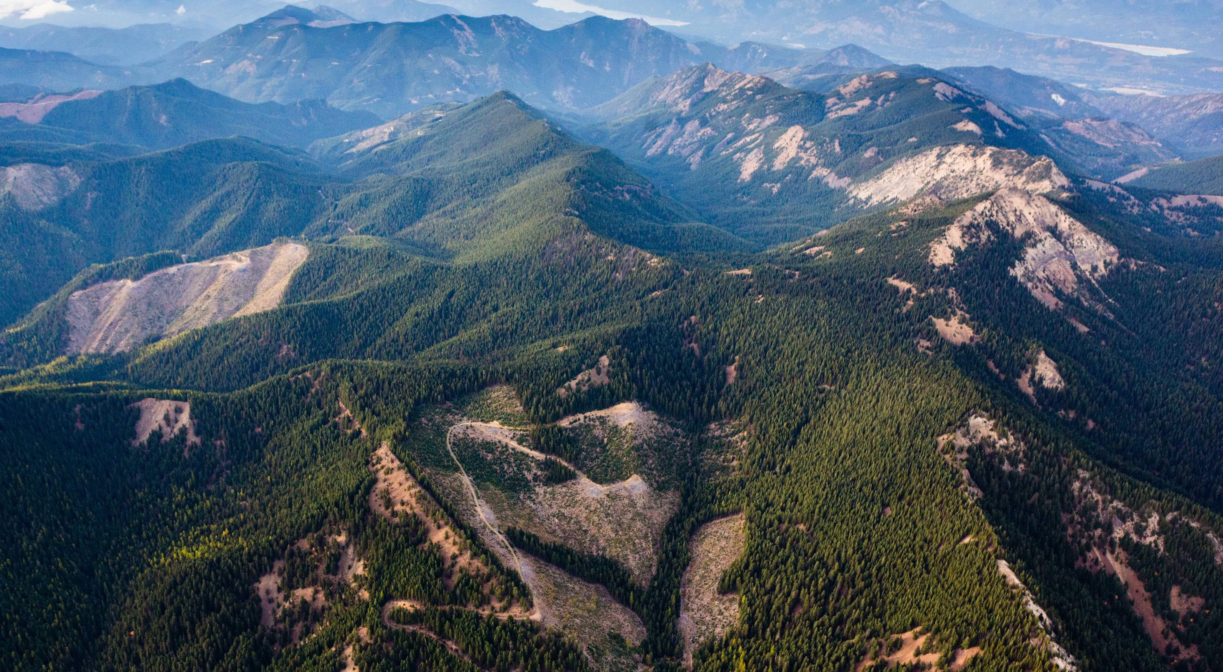 Aerial view of the Great Western Checkerboards Project south of Cabin Creek, Washington with patches of cut forest interspersed with replanted forest in the Cascade Mountains. The Great Western Checkerboards Project preserves recreational access and helps conserve the ecological integrity of 165,073 acres – 257 square miles – of forests, rivers and wildlife habitat in the Cascade Mountain Range of Washington and in the Blackfoot River Valley in Montana. This transaction with Plum Creek is one of the largest land acquisition projects ever undertaken by the Conservancy.