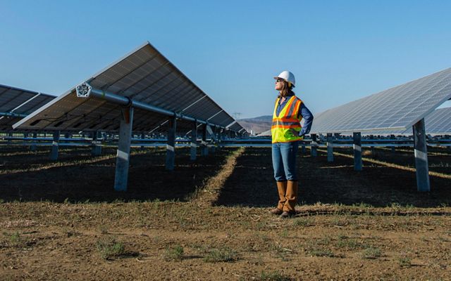 The Nature Conservancy’s Laura Crane visits a solar project under construction.