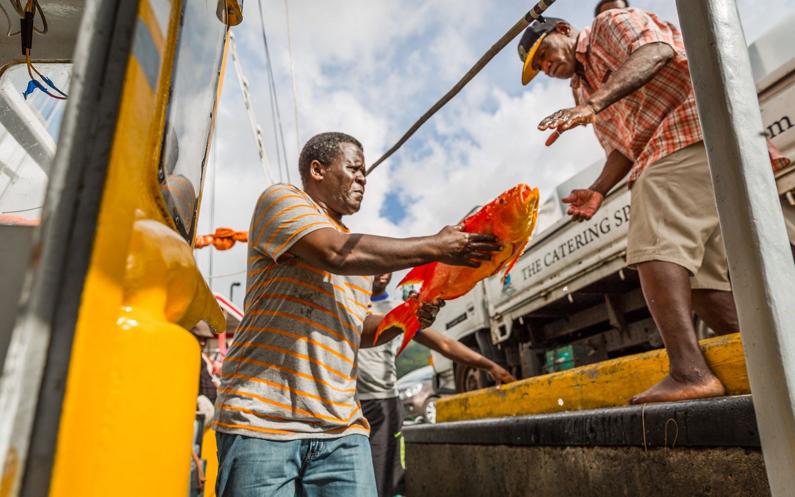Jean de Dieu Leonel, captain of the Felicite, unloading unidentified bottom fish from the Felicite, Seychelles.