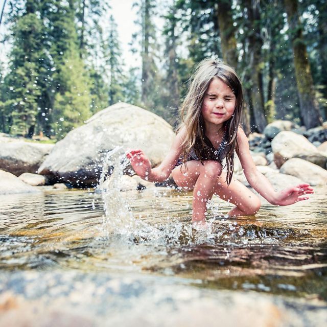 A child playing in the Marble Fork of the Kaweah River.
