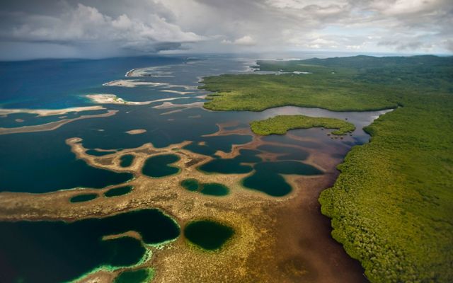 Aerial view of the Nahtik Marine Protected Area adjacent to the Enipein Mangrove Forest Reserve, Pohnpei, Micronesia.