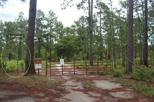 Trail entrance is marked by a yellow circle. The gate is closed, but pedestrians can still access the trail.