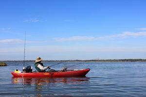 Man on a kayak fishing.