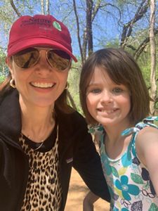 A selfie photo of a mom and her young daughter.