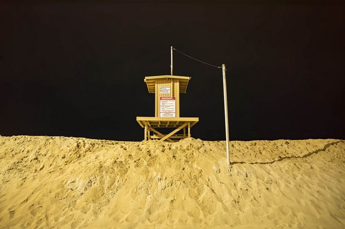 A tall sand berm at Newport Beach.