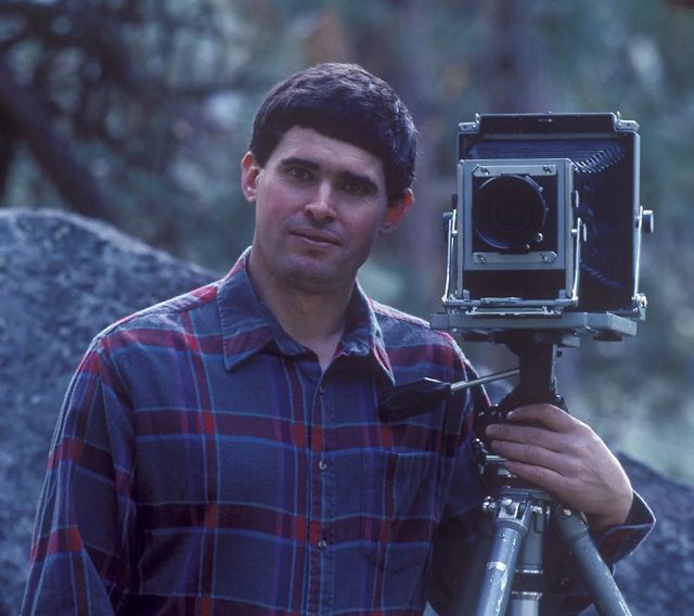 A man holding a camera.