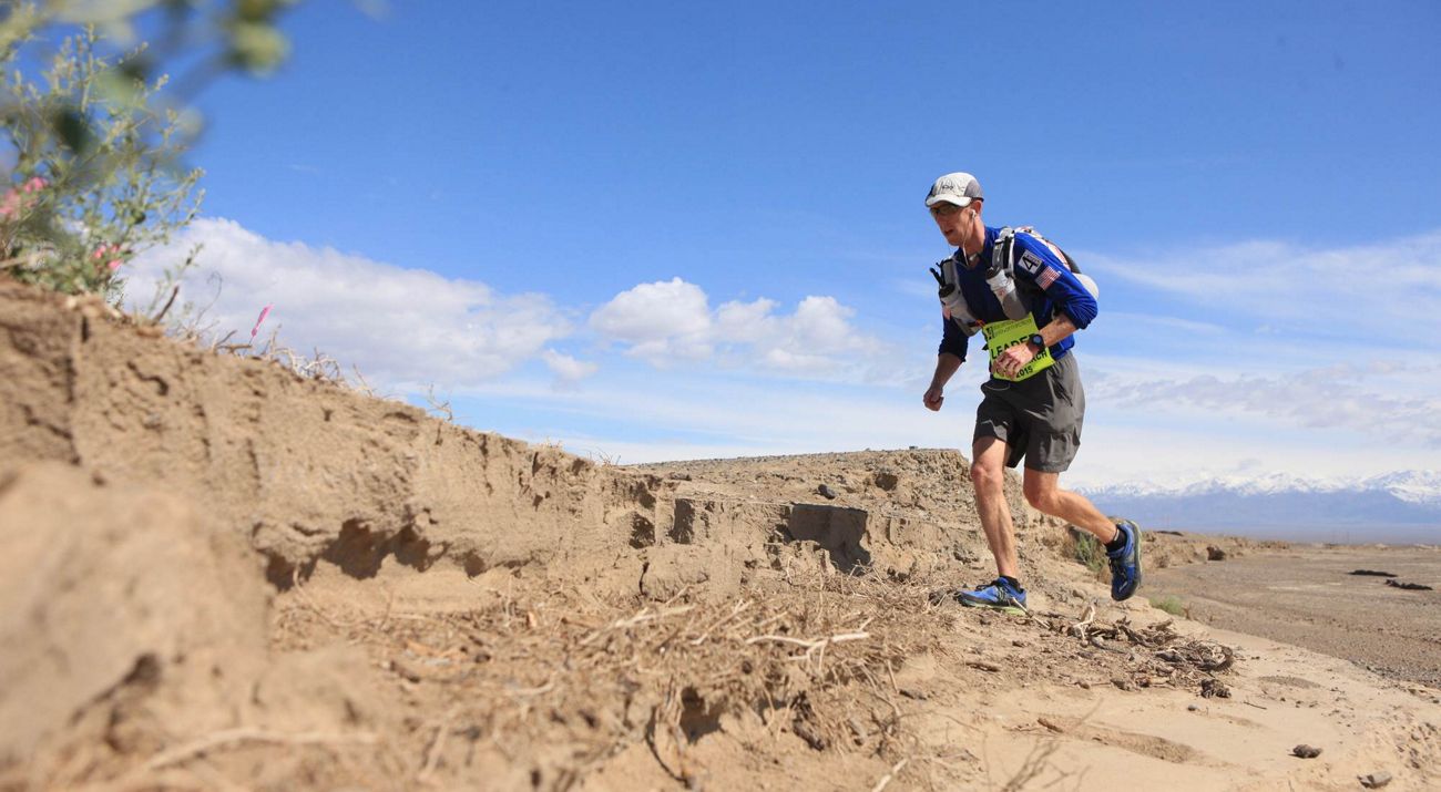 Kyle McCoy running in the desert.
