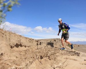 Kyle McCoy running in the desert.