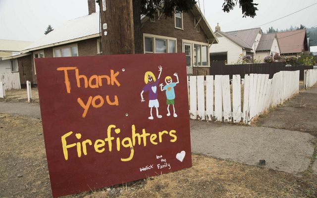 A painted sign thanking fire fighters.