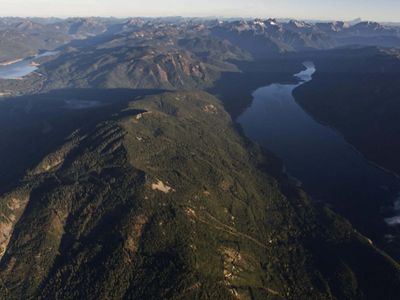 aerial image of a mountain and lake.