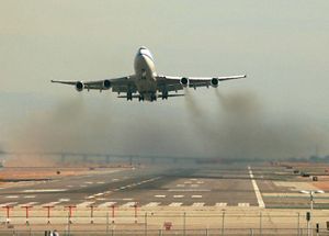 an airplane taking off from a runway.