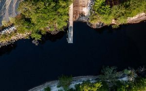 An aerial photograph shows a dock extending into water.