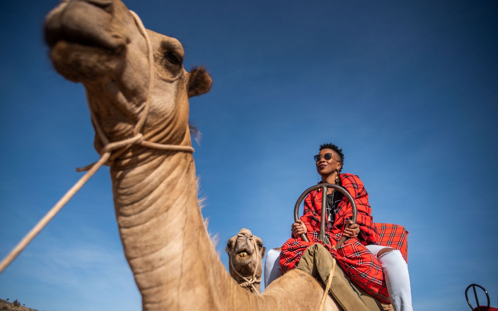 Wahu Mathenge and her daughter Tumiso take a camel ride at Loisaba Conservancy, Kenya. 