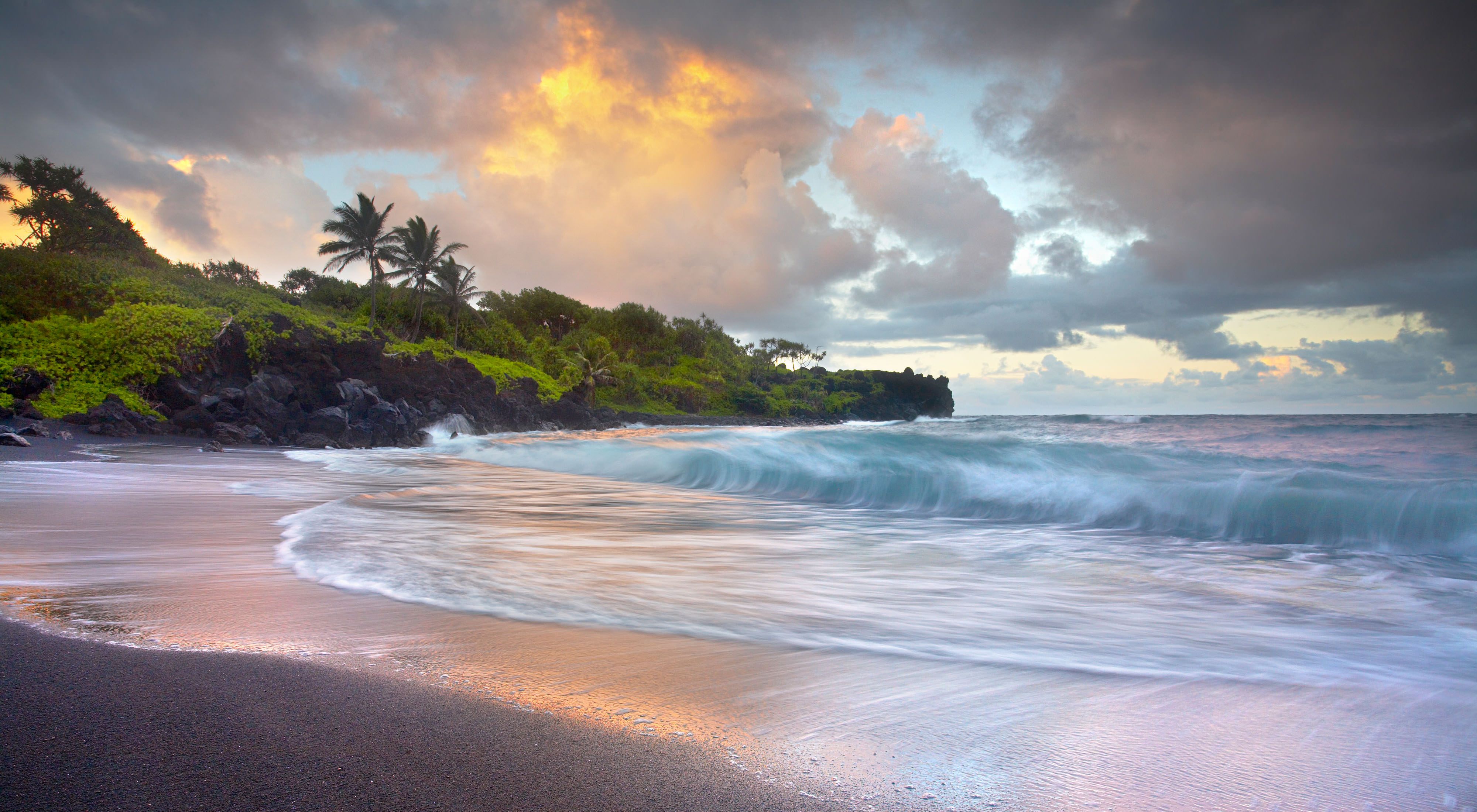 The black sand beach of Waianapanapa Sands near Hana, Maui in the Hawaiian islands. 