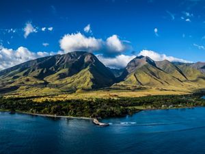 Landscape view of a large mountain range near the coast of the Hawaiian island of Maui.